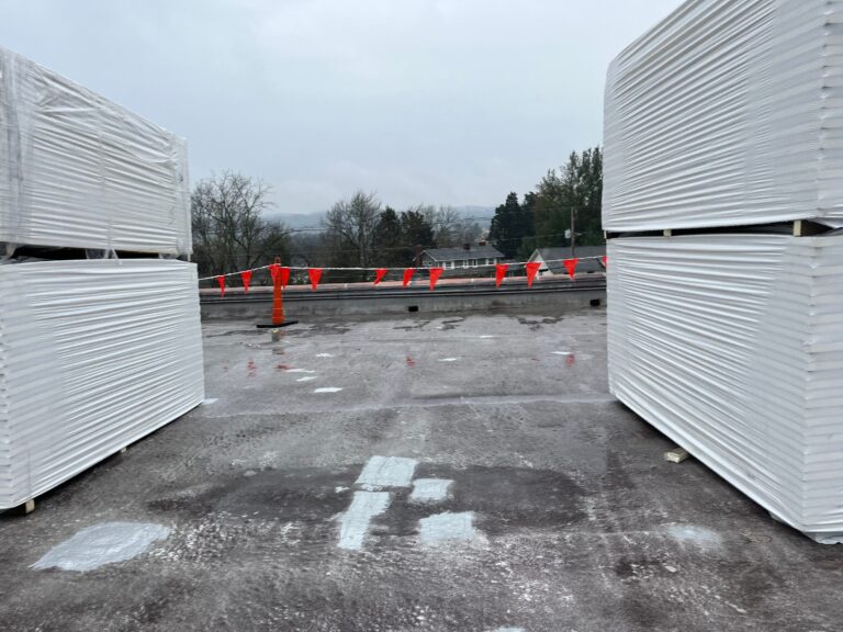 Flat commercial roof being repaired in Asheville NC