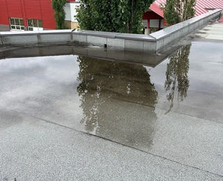 ponding on a flat commercial roof, commercial flat roof drainage, flat roof repair Asheville, commercial roofing Asheville NC, stop roof ponding, commercial roof drainage solutions, flat roof water pooling, flat roof commercial repair, commercial roof leaks, flat roof replacement Asheville, TPO commercial roofing, EPDM roof ponding fix, prevent commercial roof damage, roof maintenance Asheville business, commercial roof inspection service